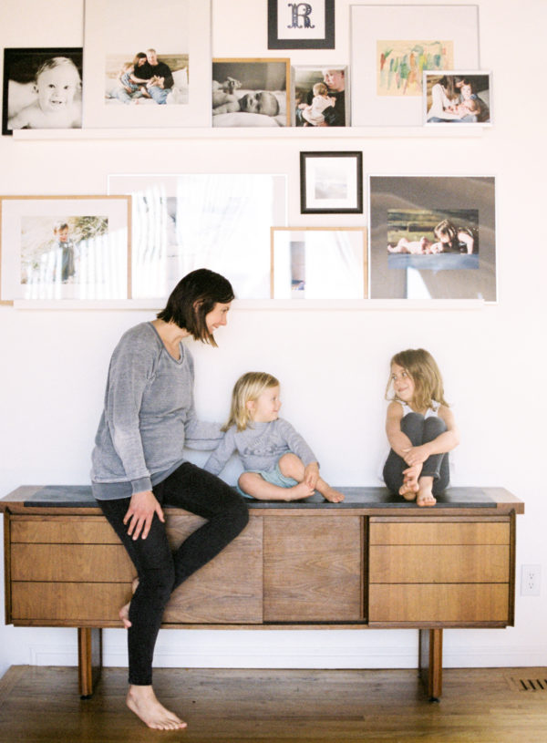 mother sitting with children on credenza