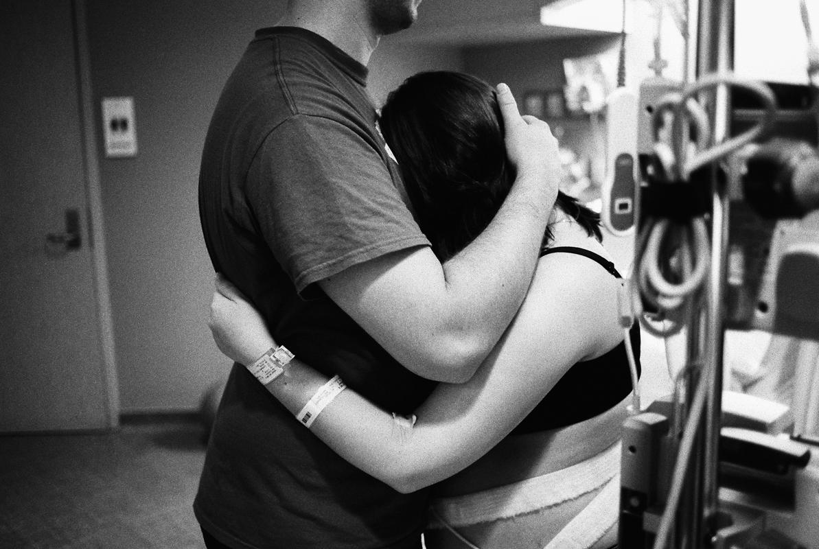 husband and wife embracing during labor