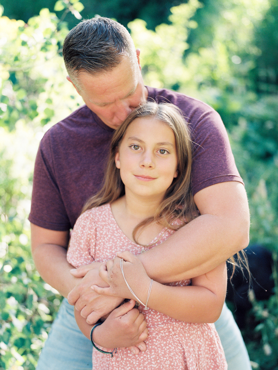 father hugging daughter