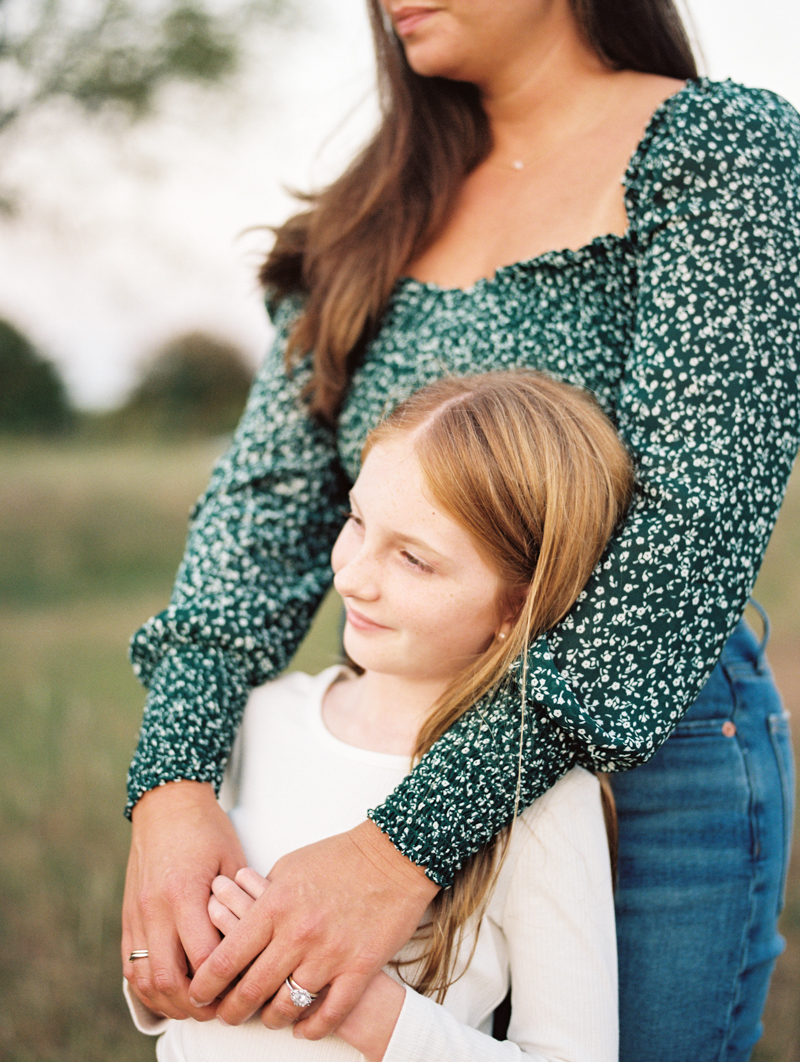 mother holding daughter in arms