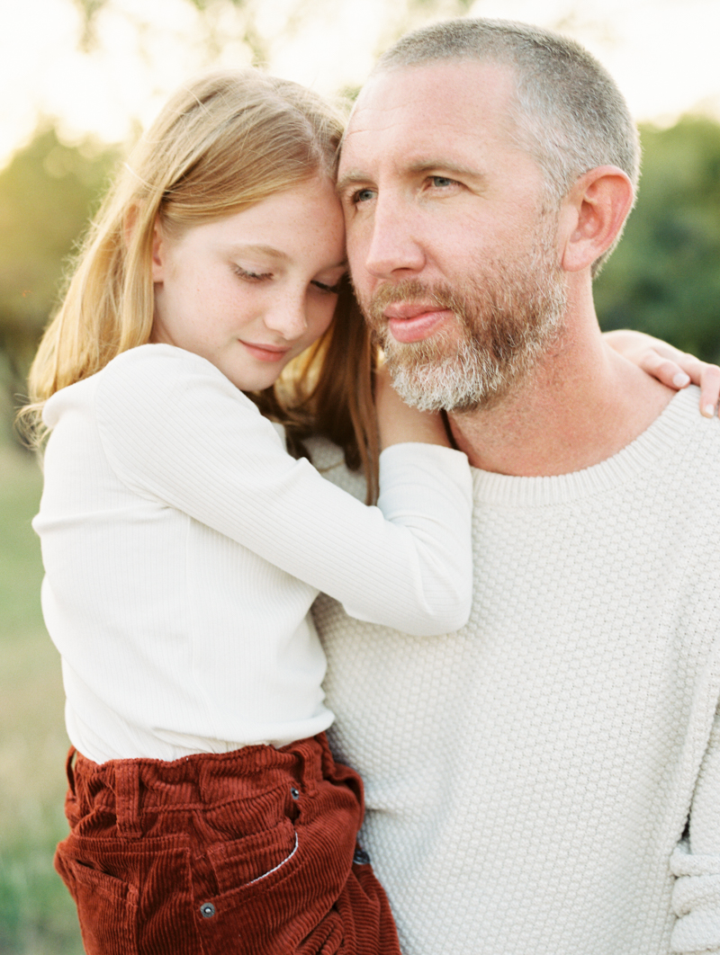 father holding daughter