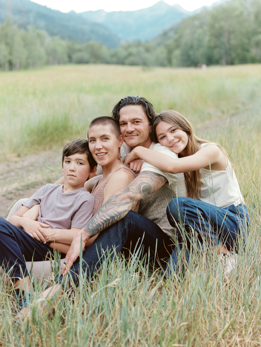 family portrait sitting in tall grass