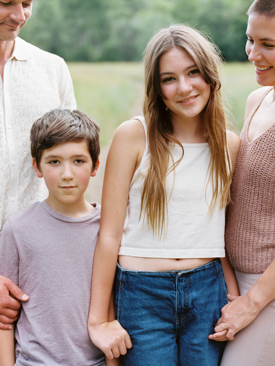 mom and dad looking at son and daughter