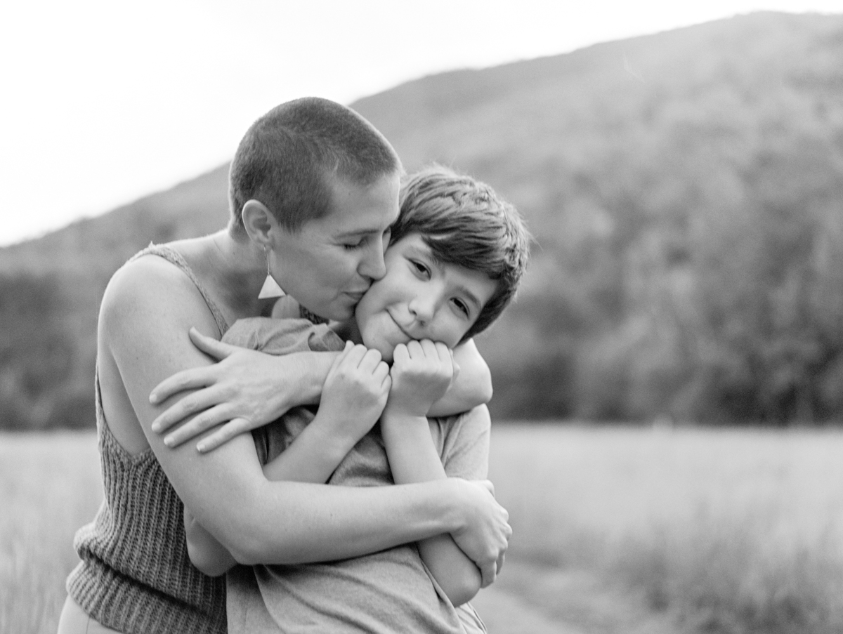 mom kissing son's cheek