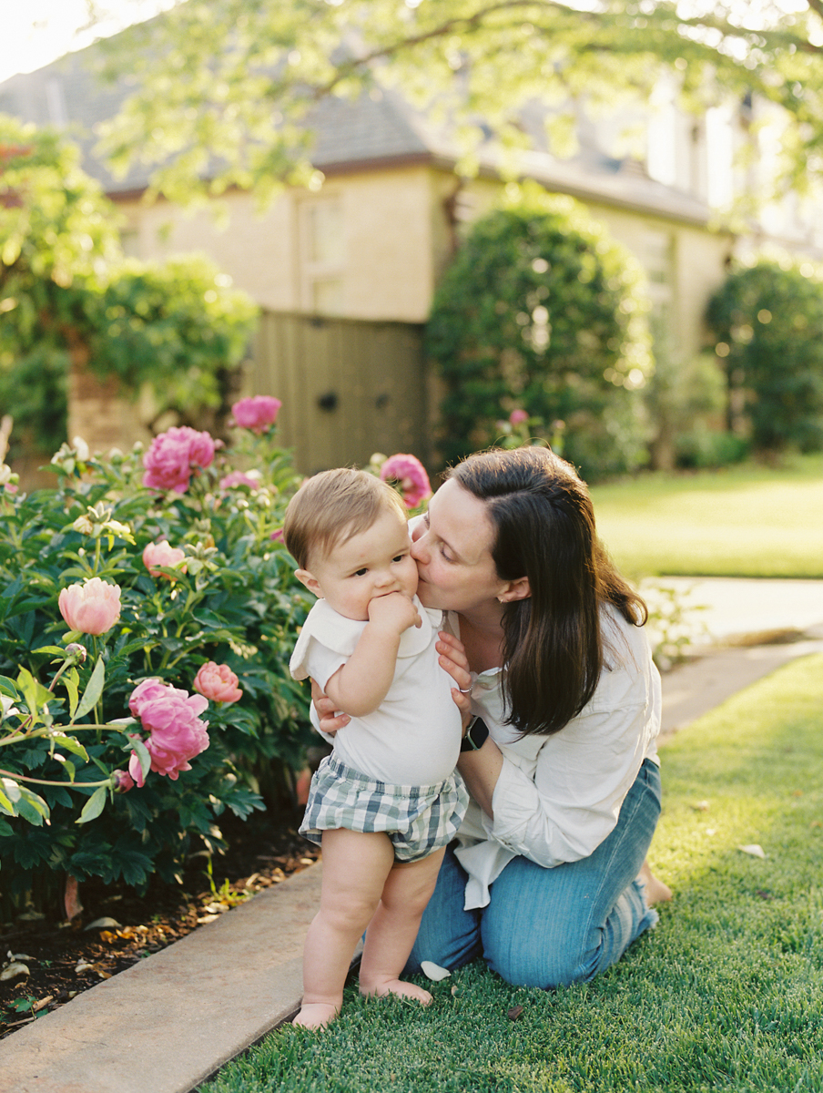 okc mom kissing little son's cheeks