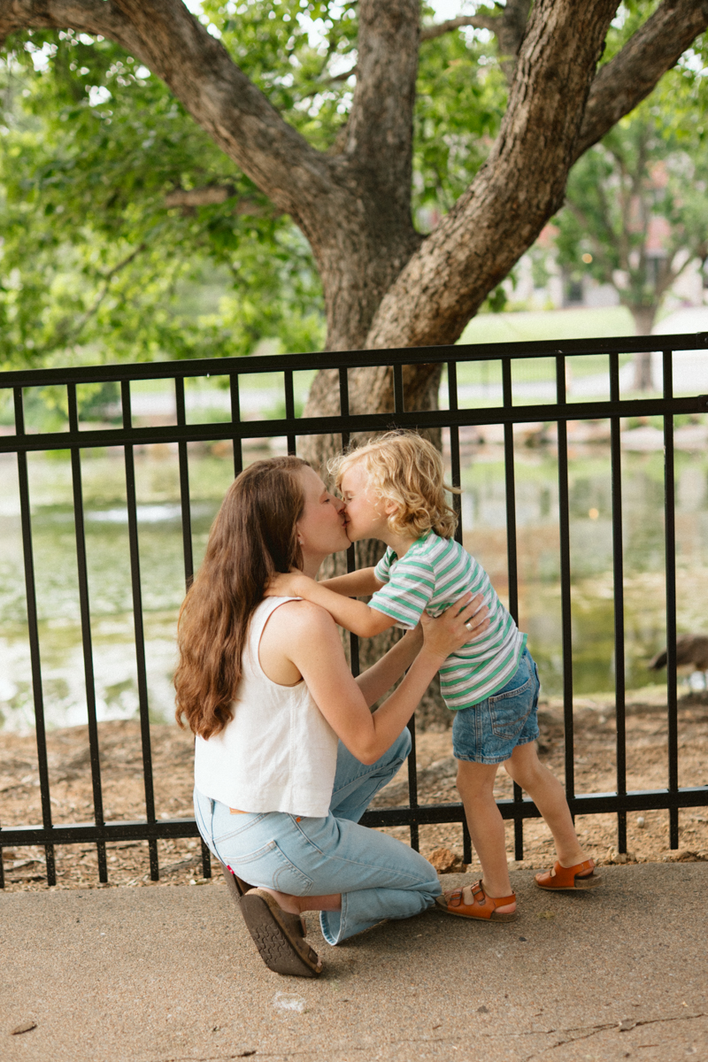 mother kissing her young son during a photo session in Oklahoma City
