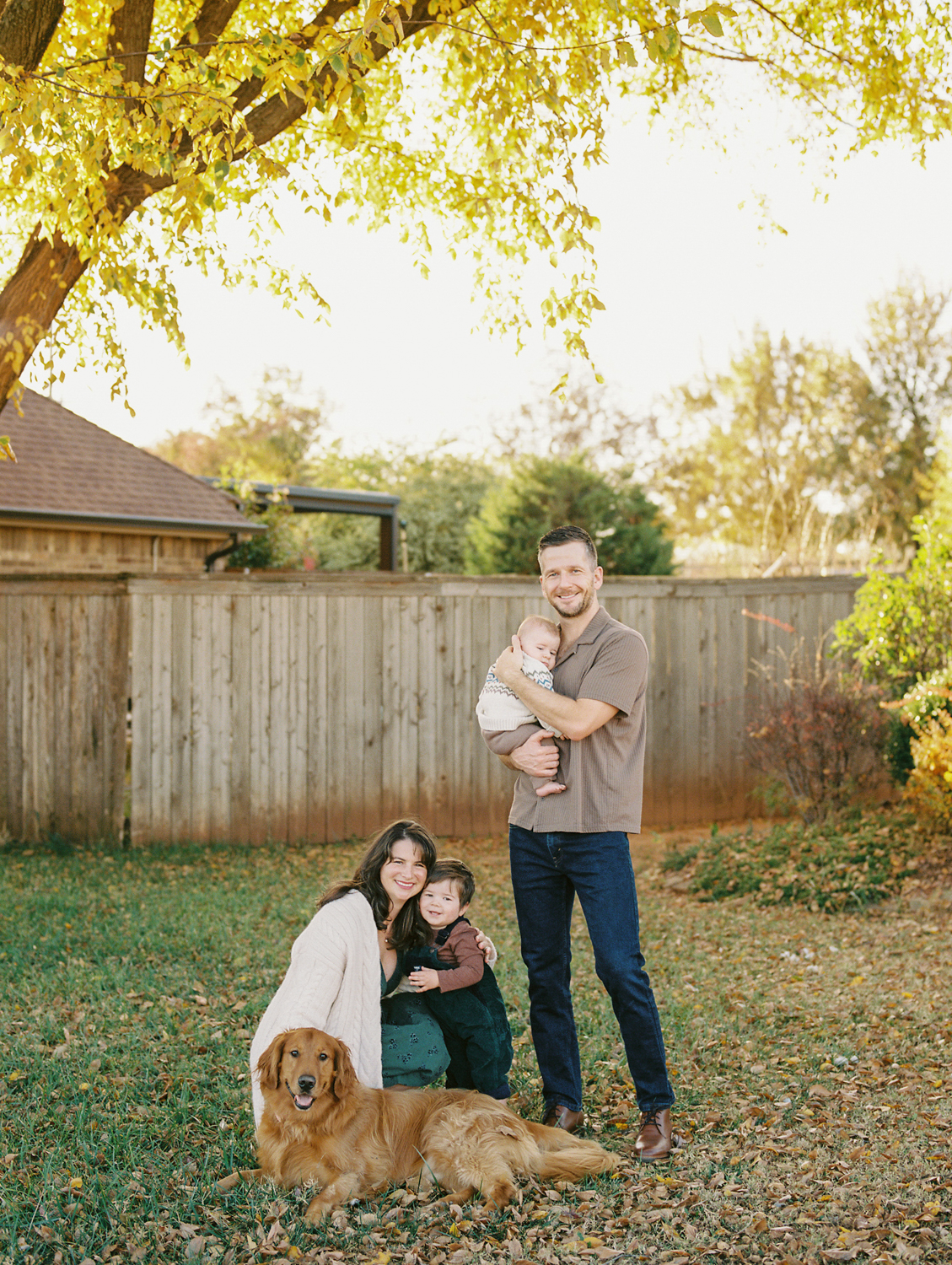 Family smiling with kids during a relaxed family session near Edmond, OK.