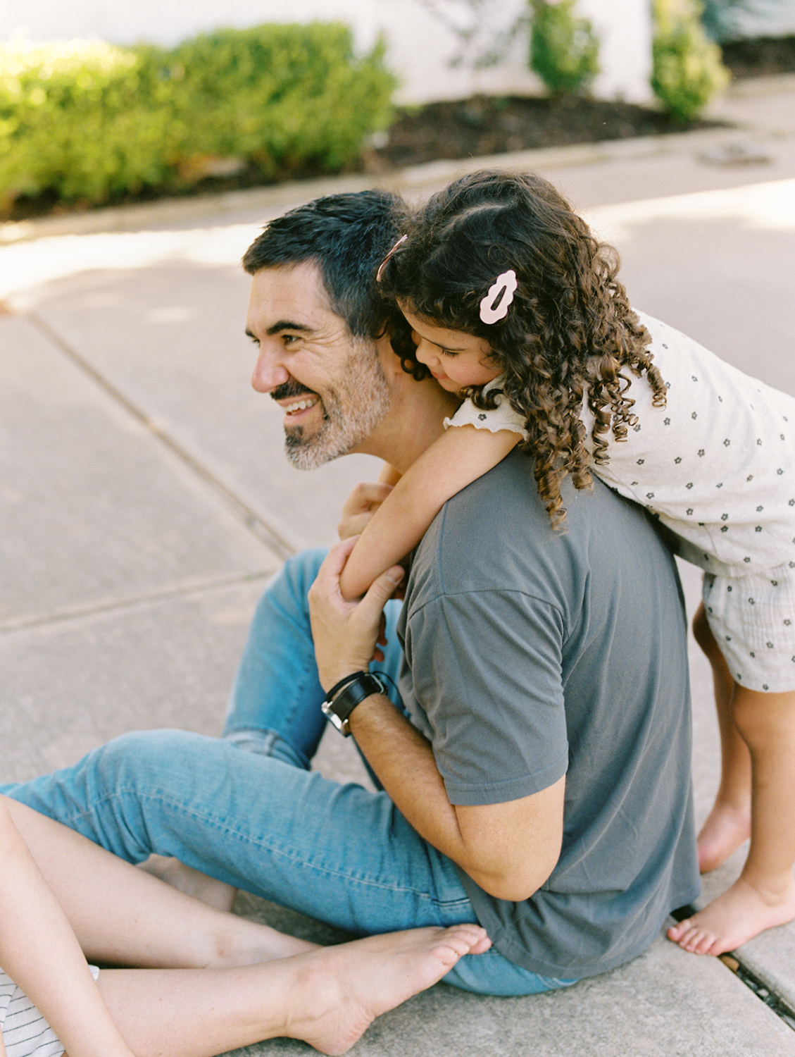 natural, unposed family photography moment in Oklahoma City showing genuine connection between parent and child