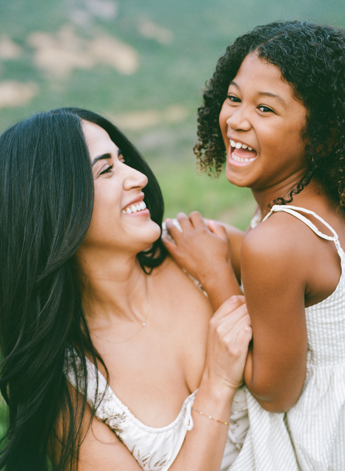 mother and daughter laughing