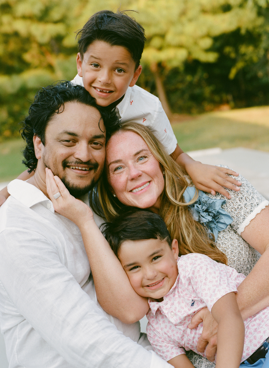 portrait of a family snuggled together