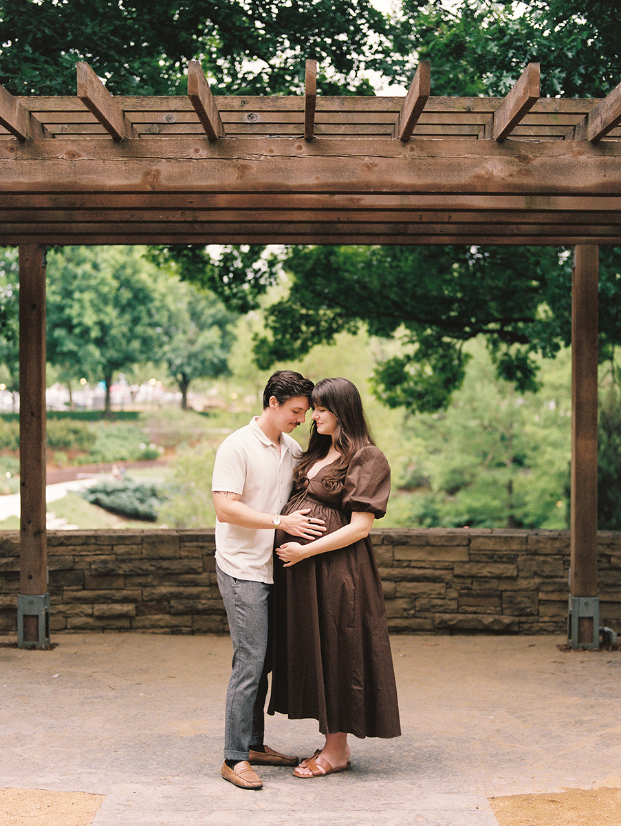 maternity portrait of young couple at the myriad gardens in oklahoma city